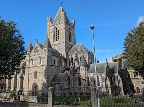 A large building with a tall tower and a clock on it's side