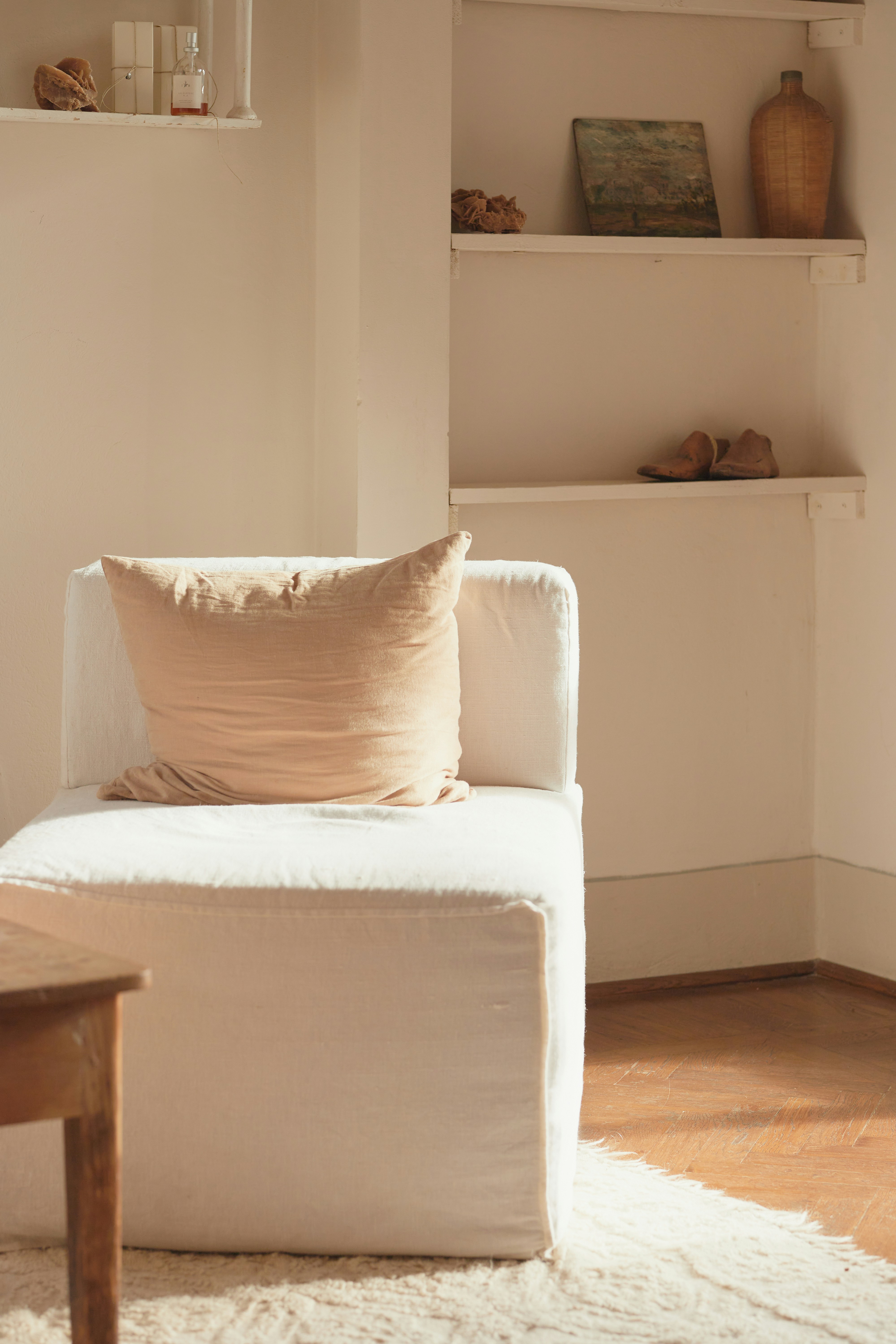 A living room with a white couch and a coffee table