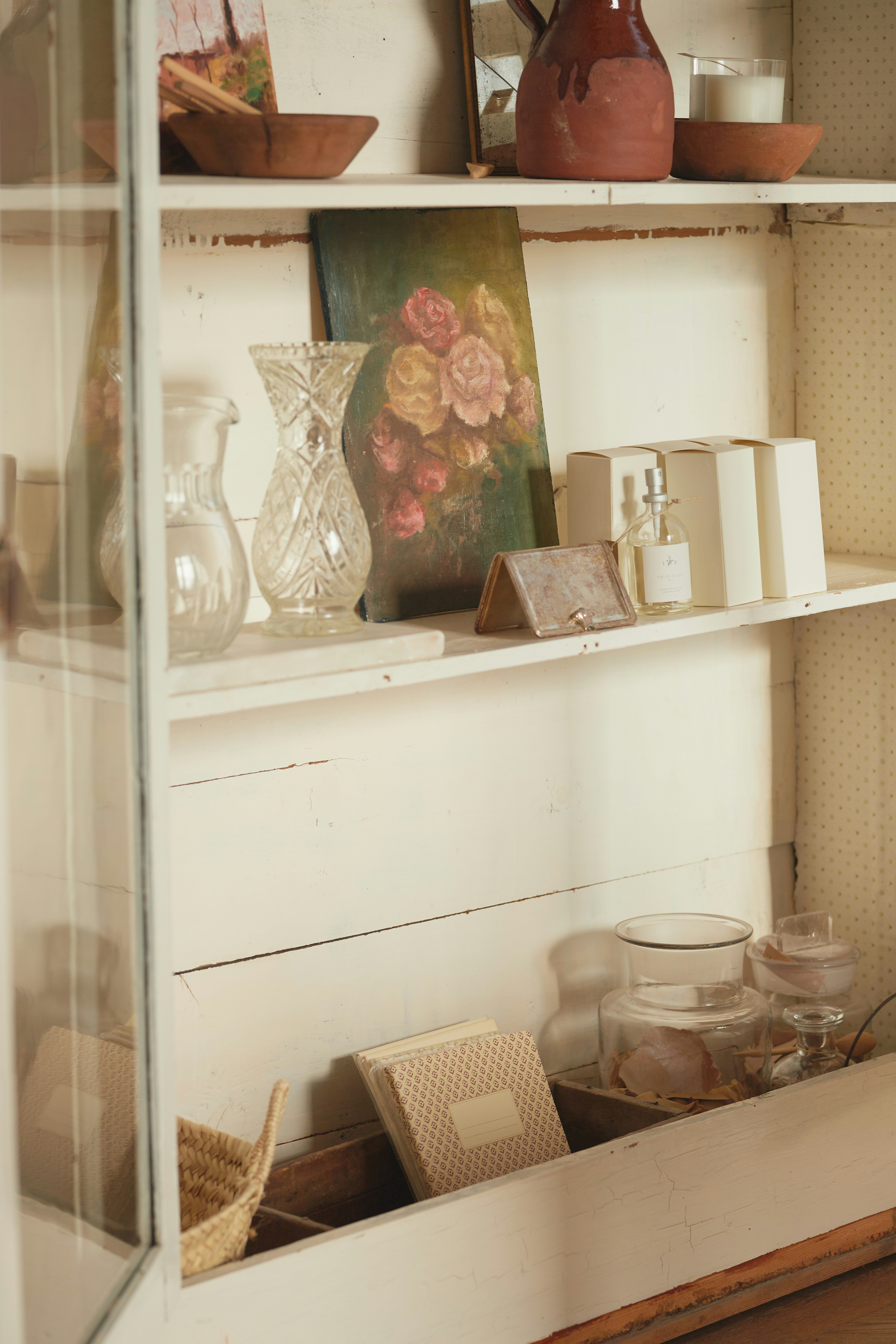 A shelf filled with vases and other items