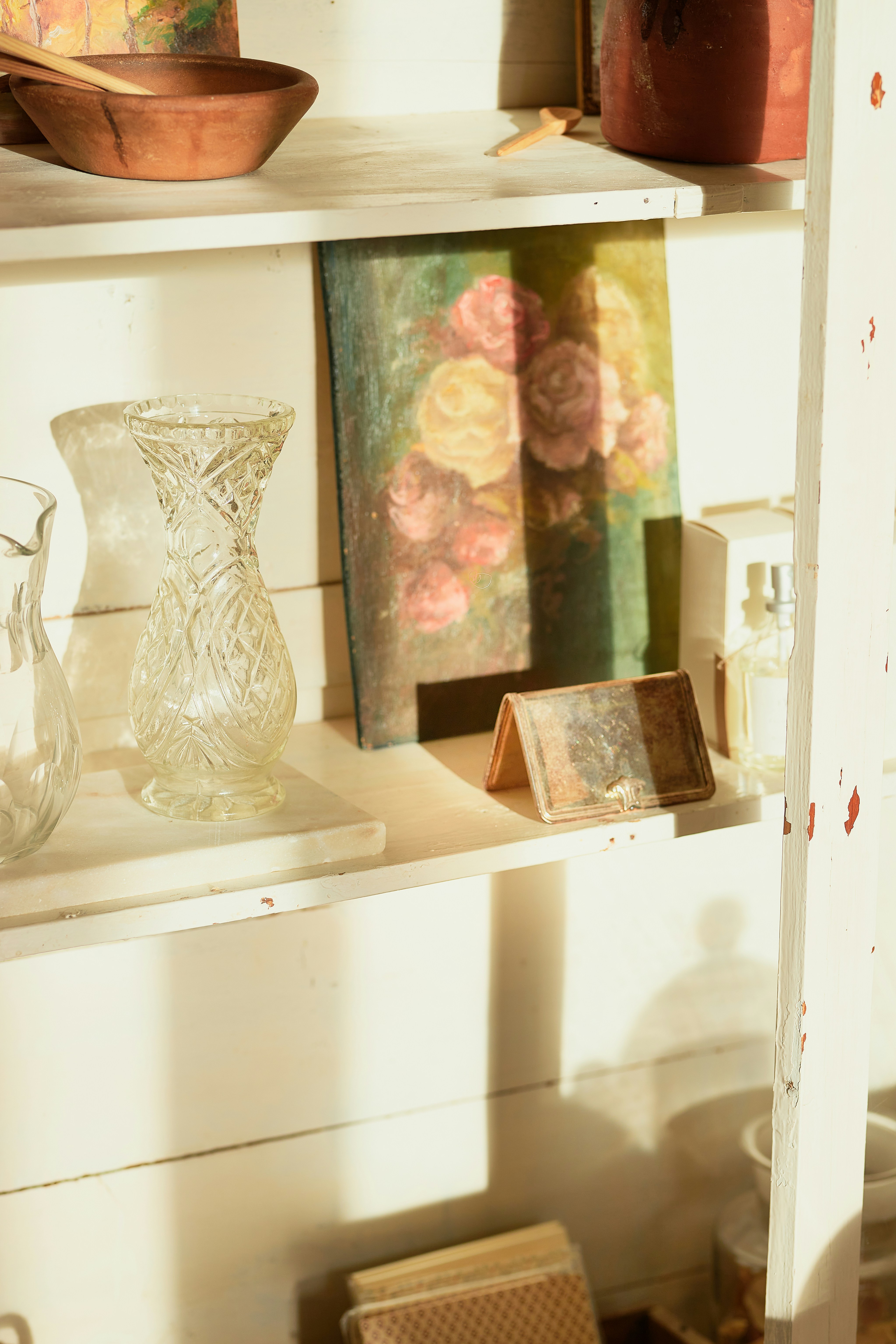 A shelf with vases and other items on it