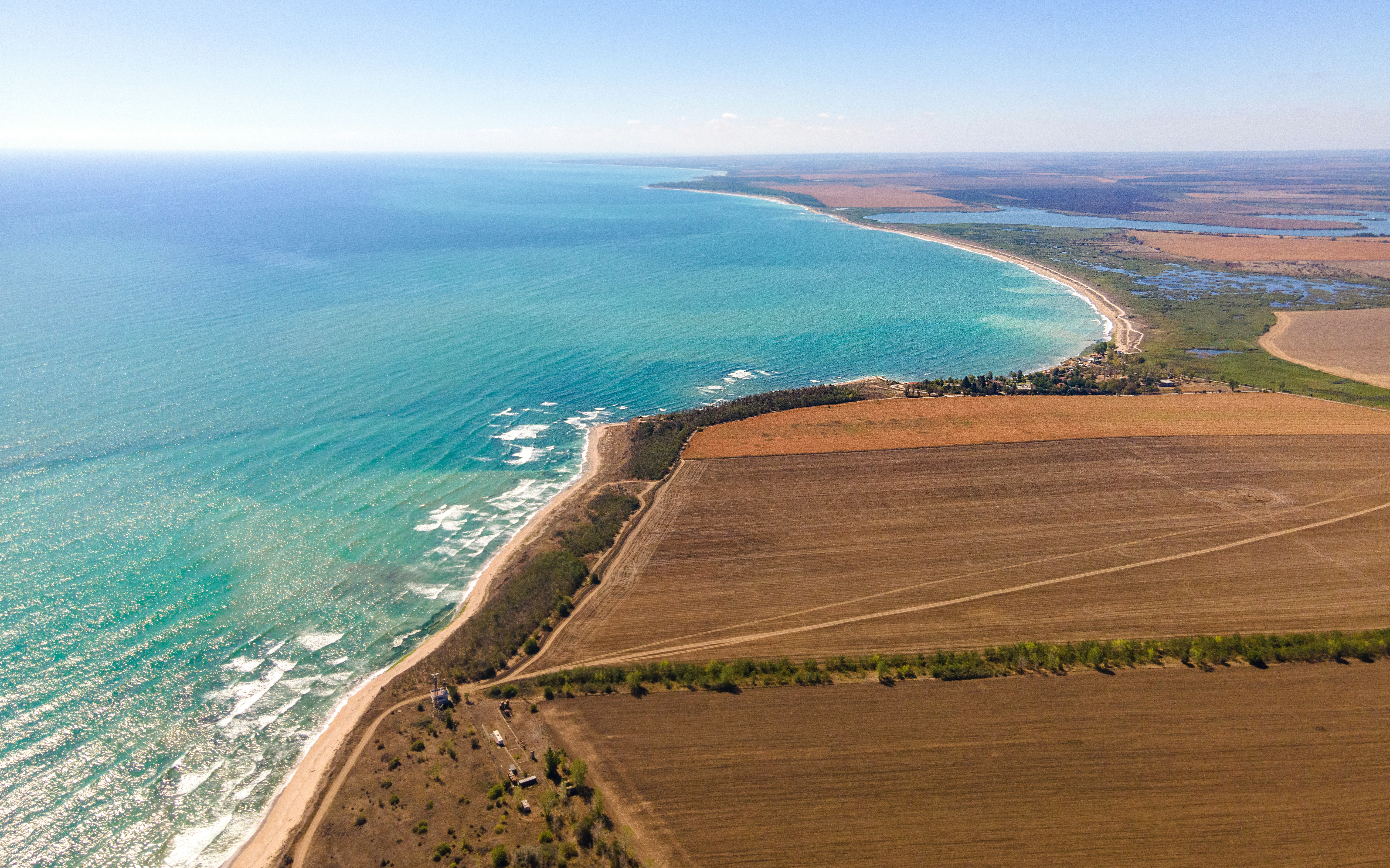 An aerial view of a beach and a body of water