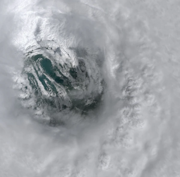 Satellite view of a swirling hurricane eye over the ocean