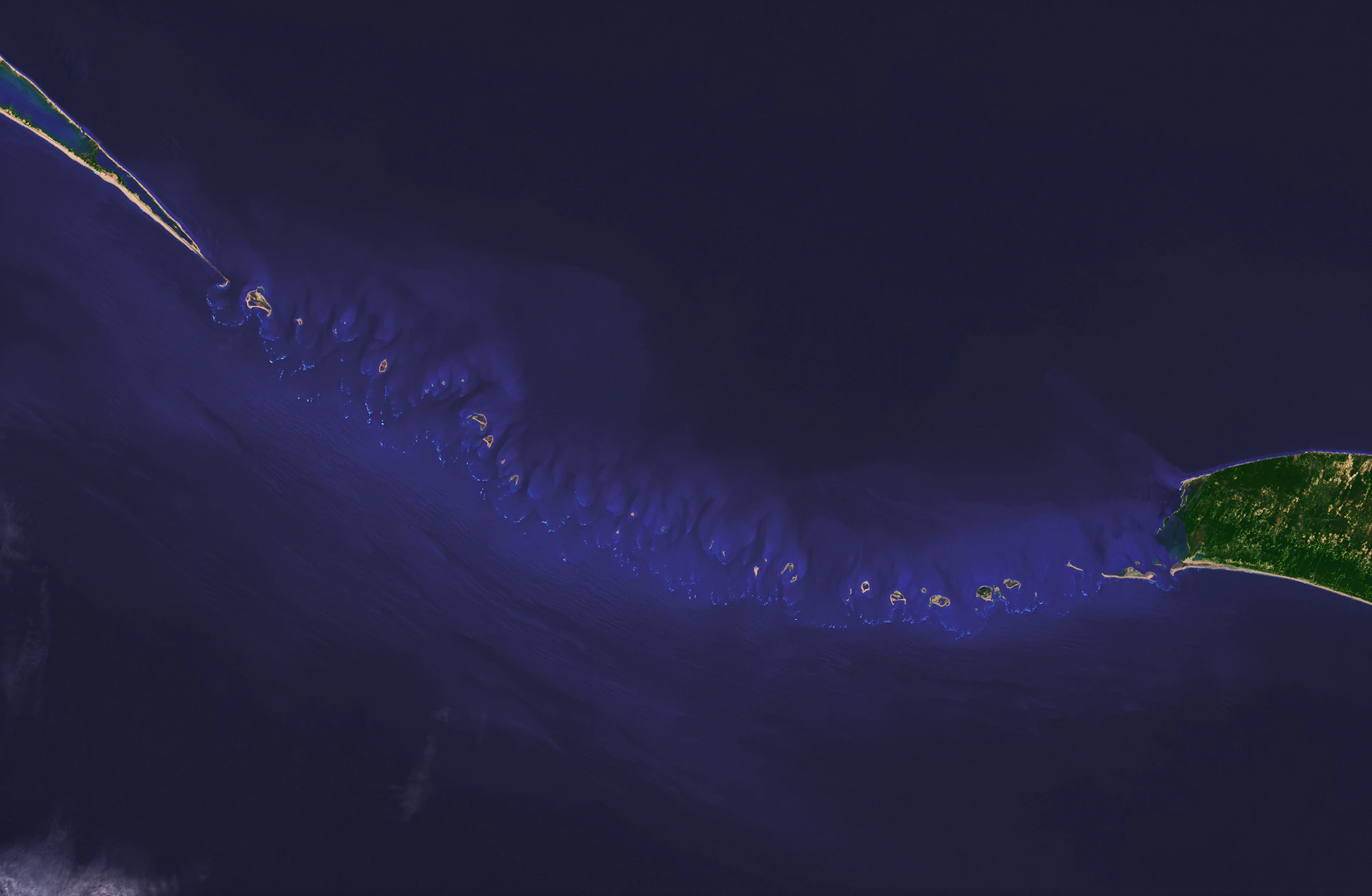 Aerial view of a chain of islands in the ocean
