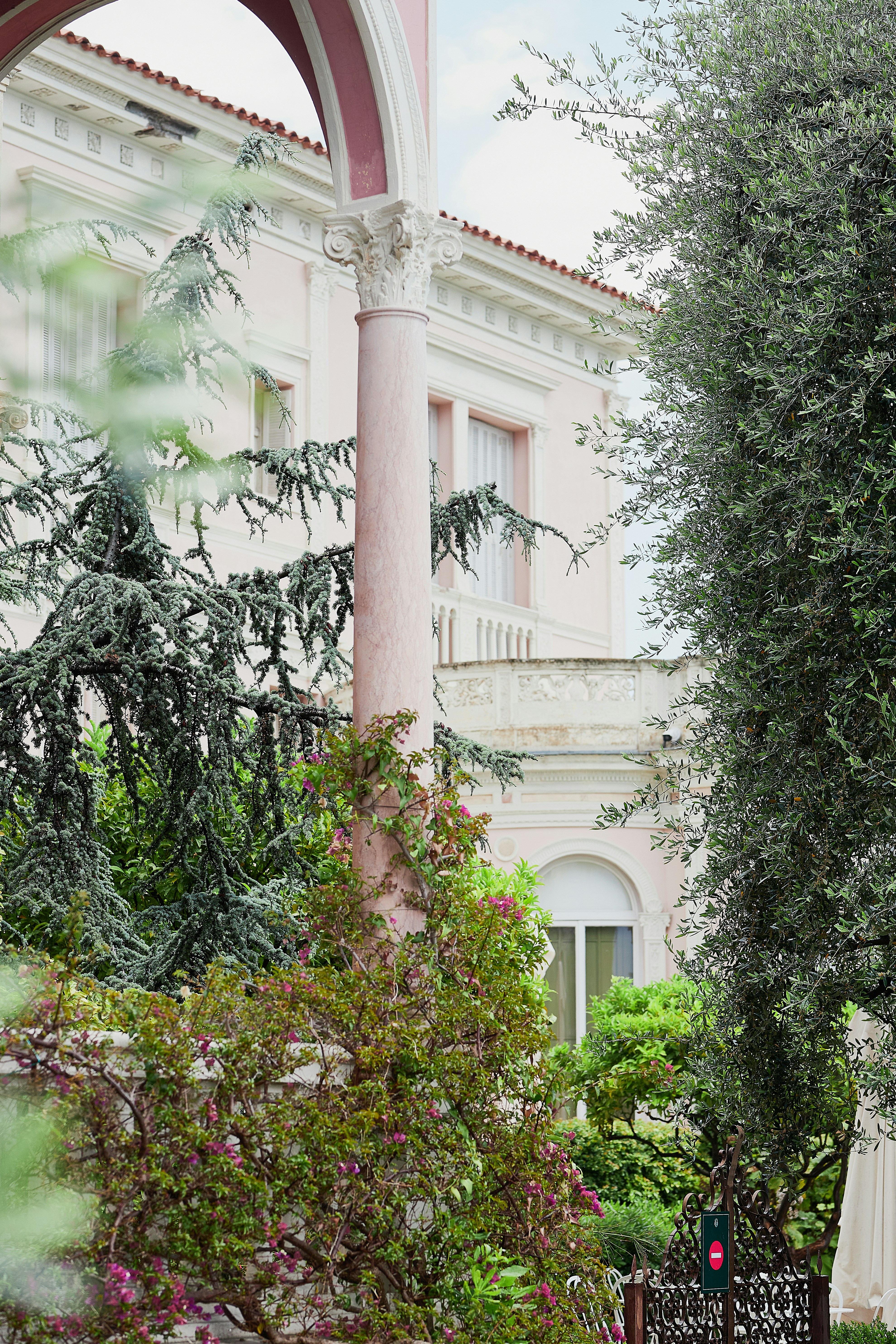 A bride and groom standing in front of a building