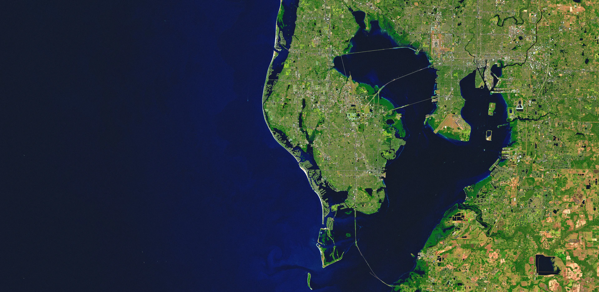 Aerial view of a coastline with a large bay.