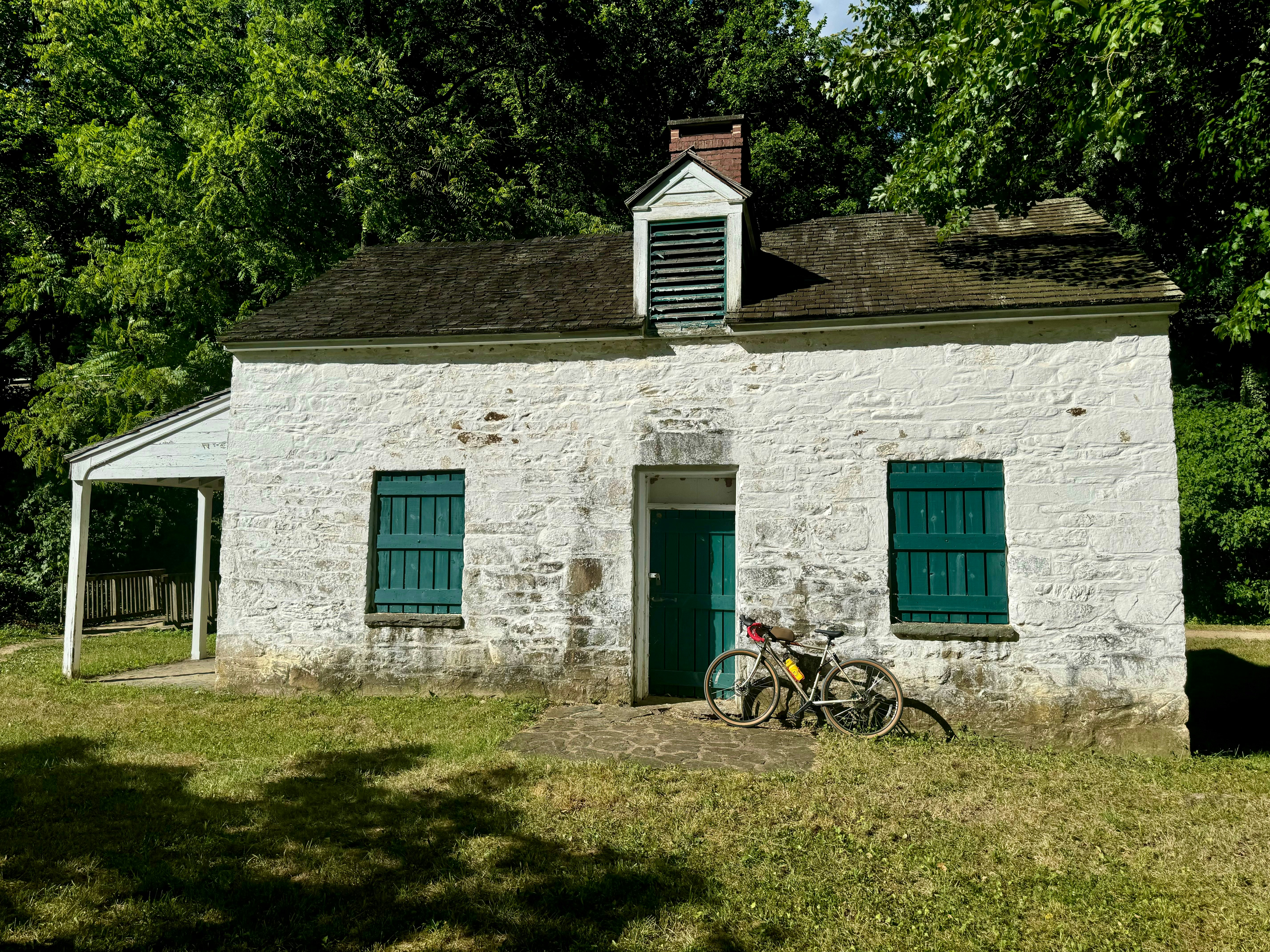 A bike parked in front of a white building