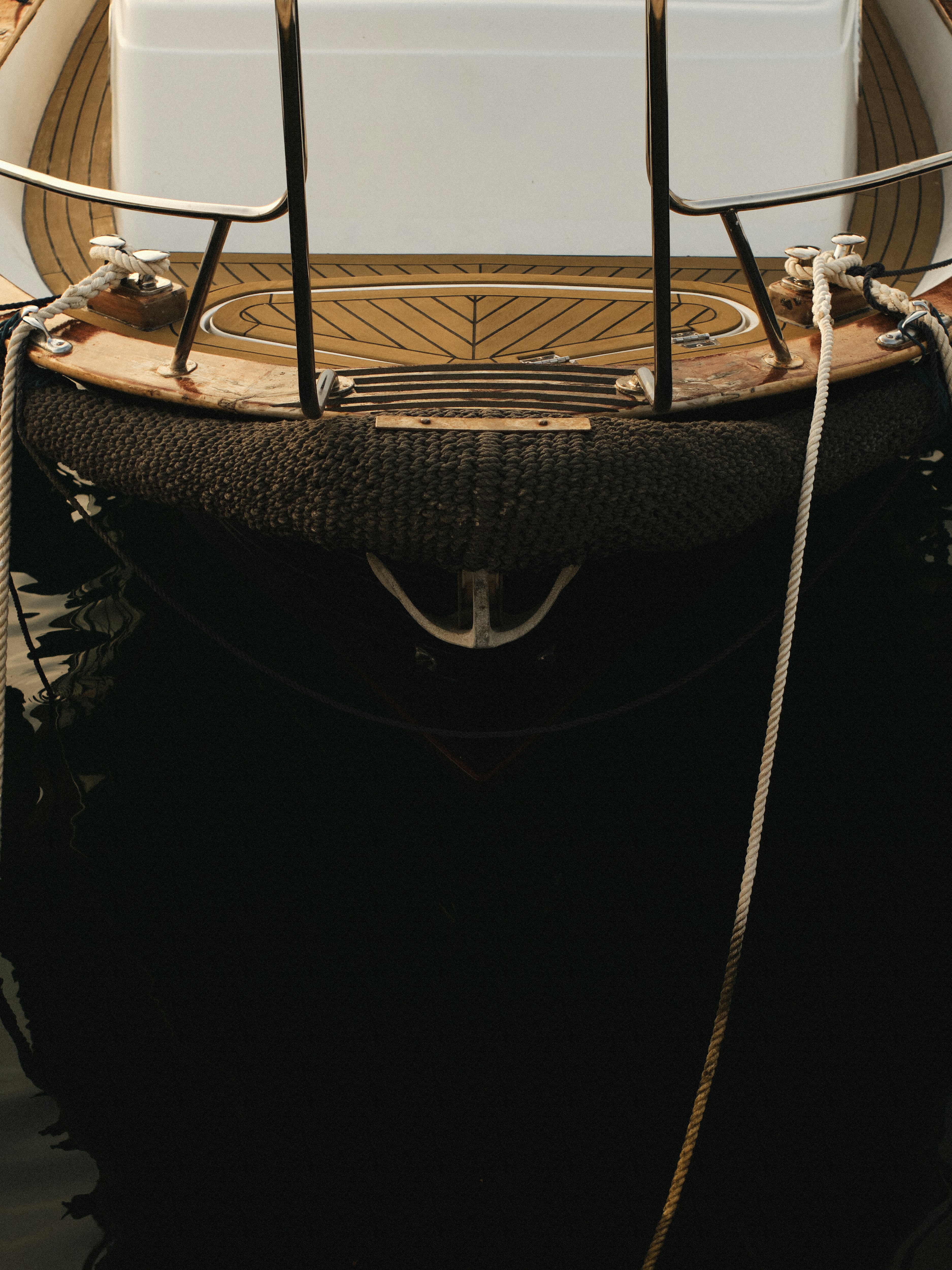 A small boat with a cooler on top of it