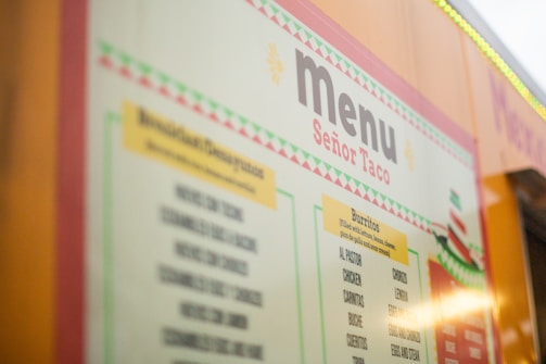 A menu board with asian writing on it