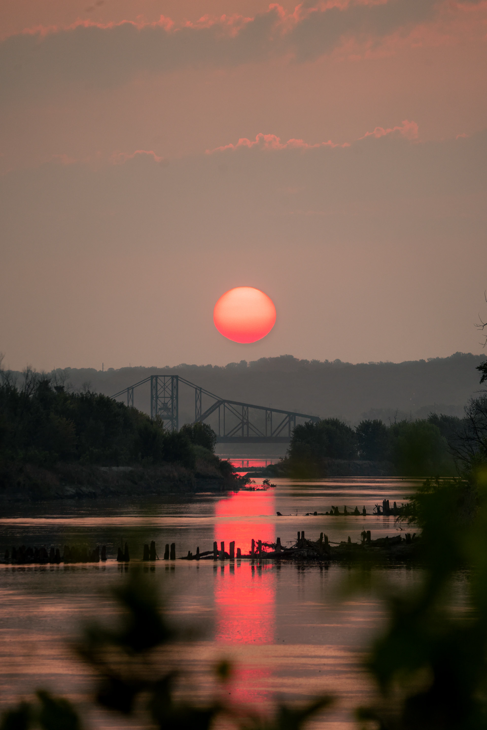 The sun is setting over a body of water