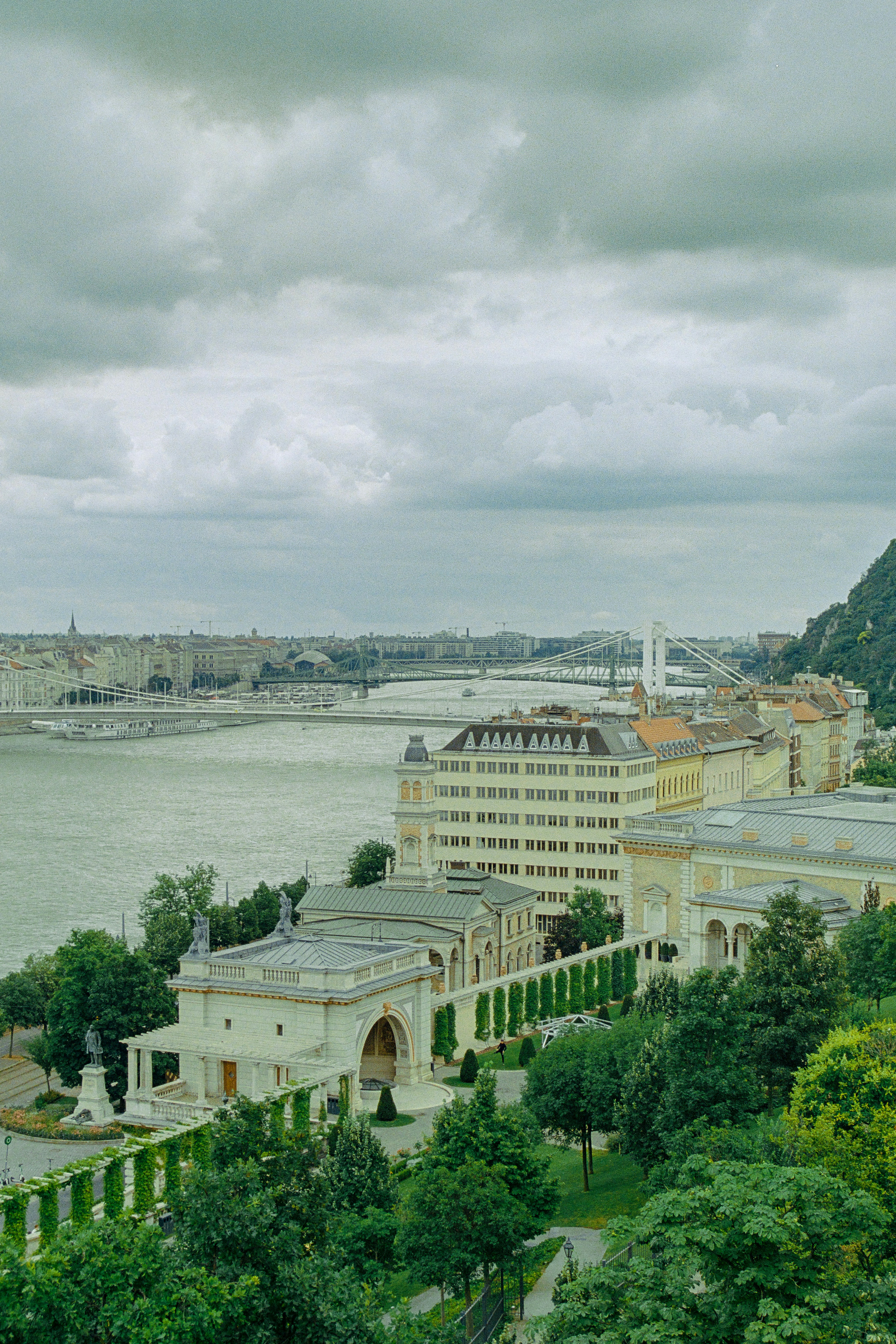 A view of a large building next to a body of water