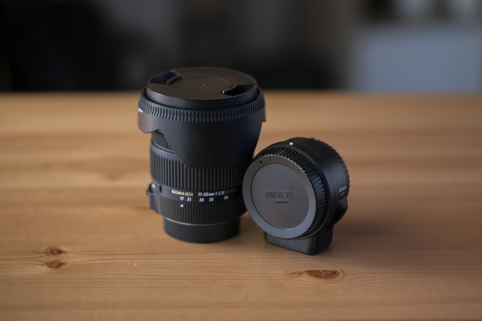 A camera lens sitting on top of a wooden table