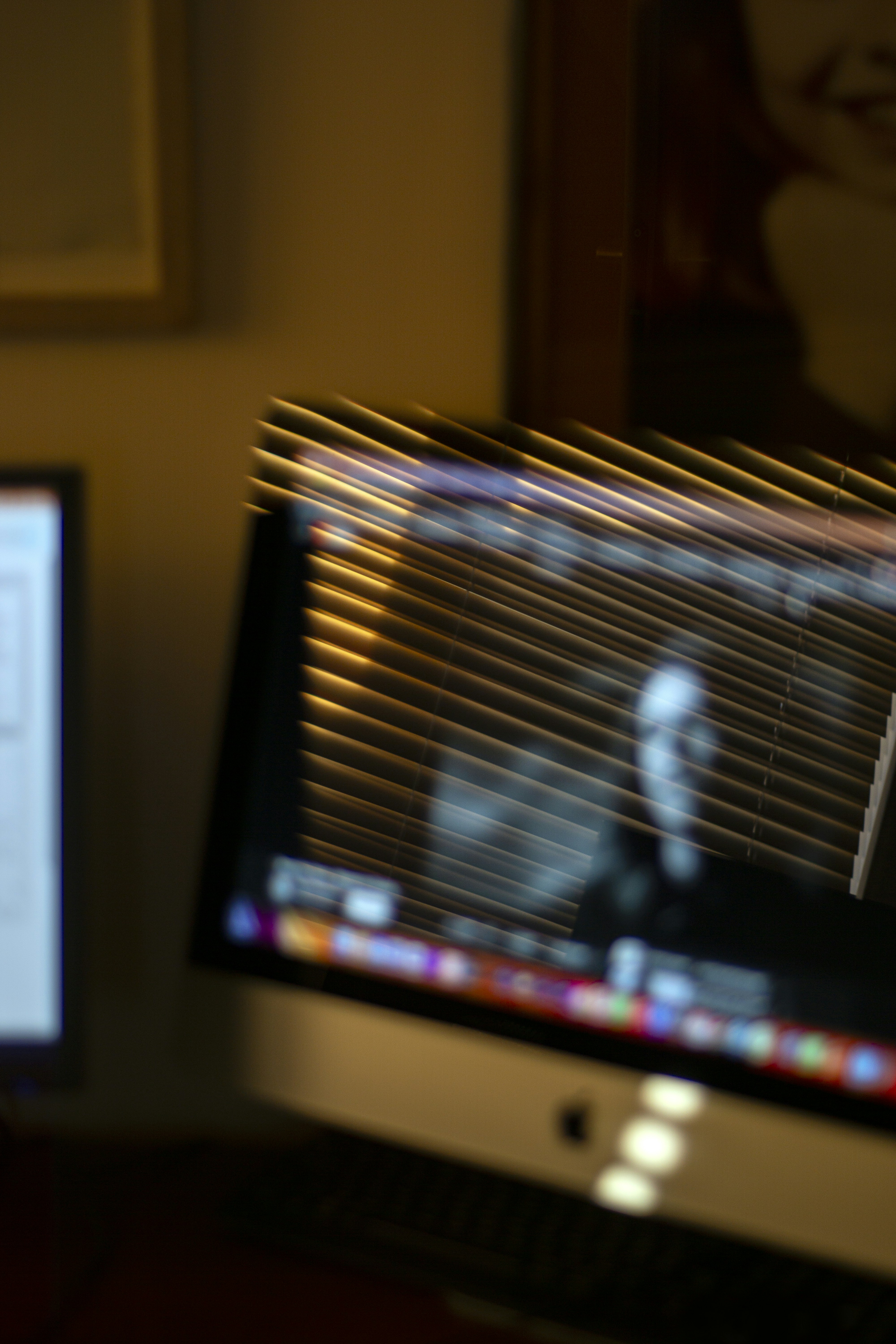A computer monitor with a blurry image of a person on the screen