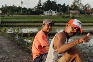 A couple of men sitting next to each other