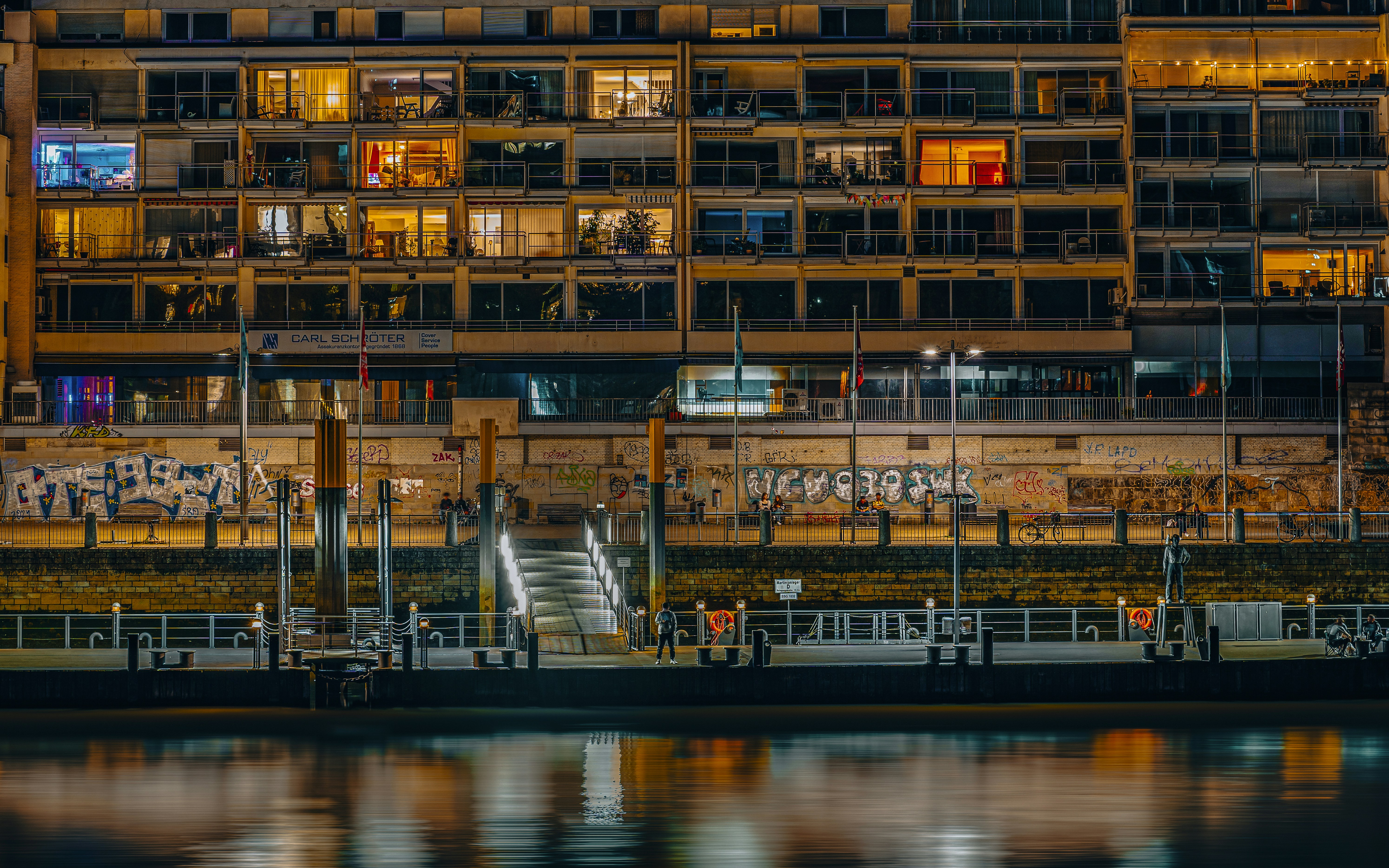 A large building sitting next to a body of water