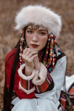 A woman in a costume sitting on the ground