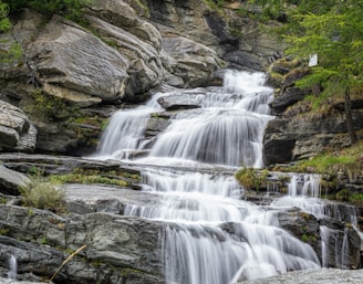 A small waterfall in the middle of a forest