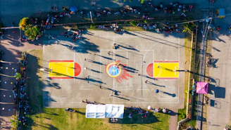 An aerial view of a basketball court in a parking lot