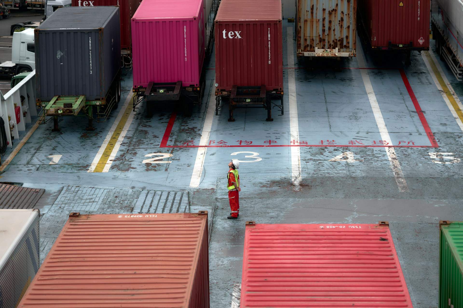 A cargo truck is parked in a parking lot