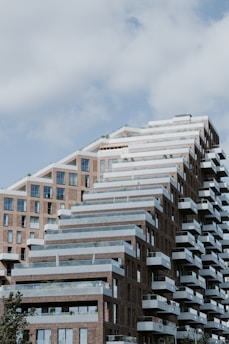 A tall building with balconies on top of it