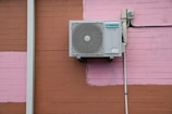 A air conditioner mounted to the side of a building