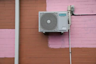 A air conditioner mounted to the side of a building