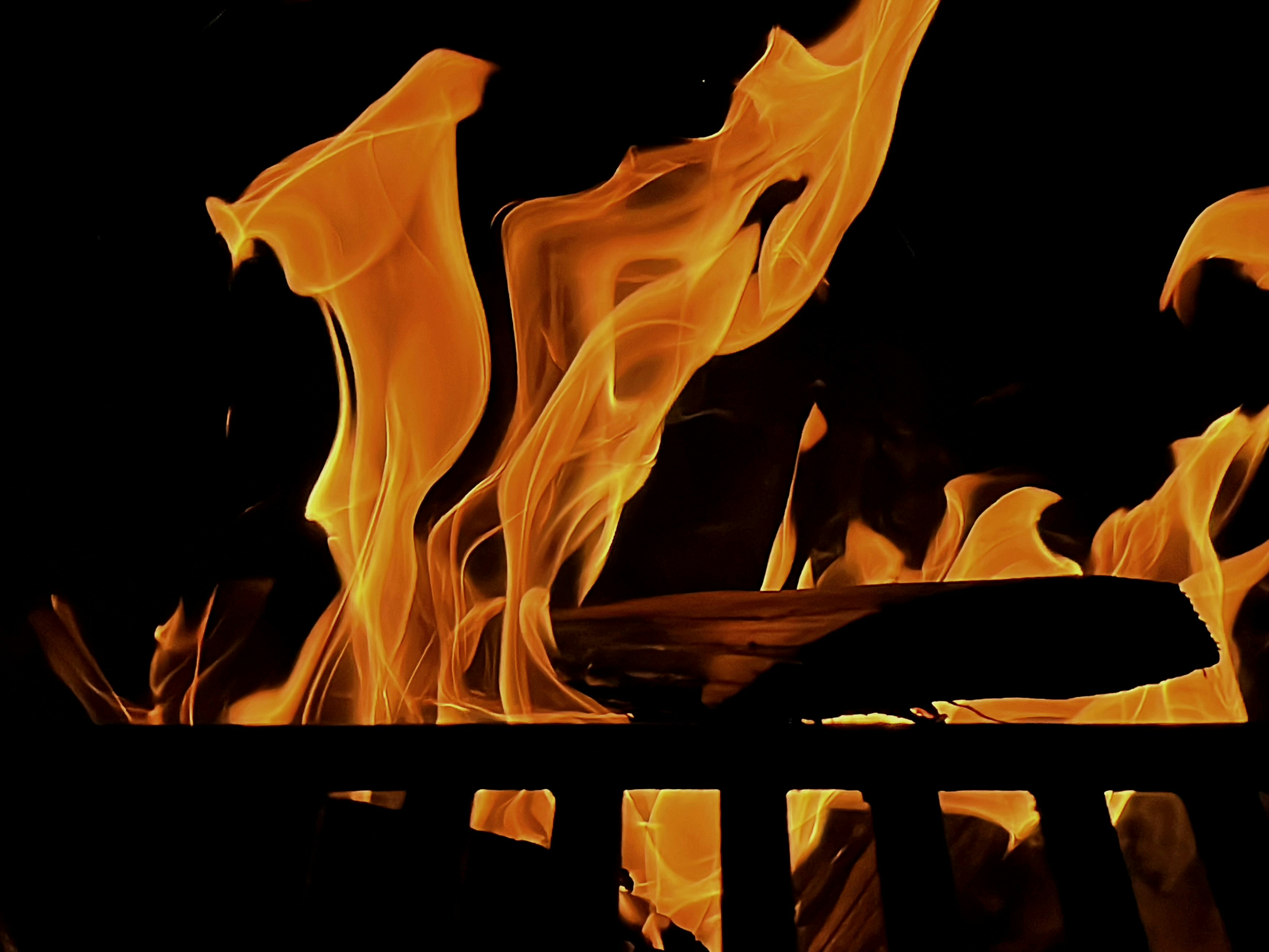 A close up of a fire in a fireplace