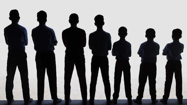 A group of people standing next to each other