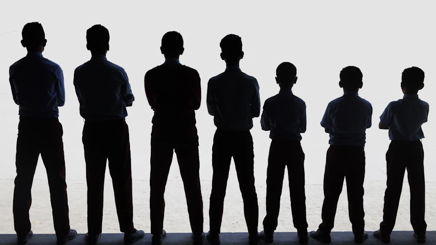 A group of people standing next to each other