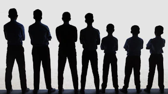 A group of people standing next to each other