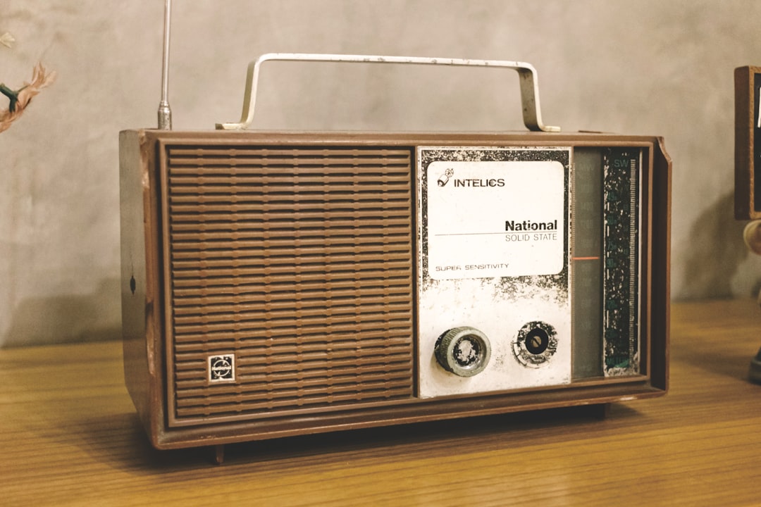 A radio sitting on top of a wooden table,