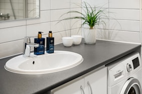 A washer and dryer in a small bathroom