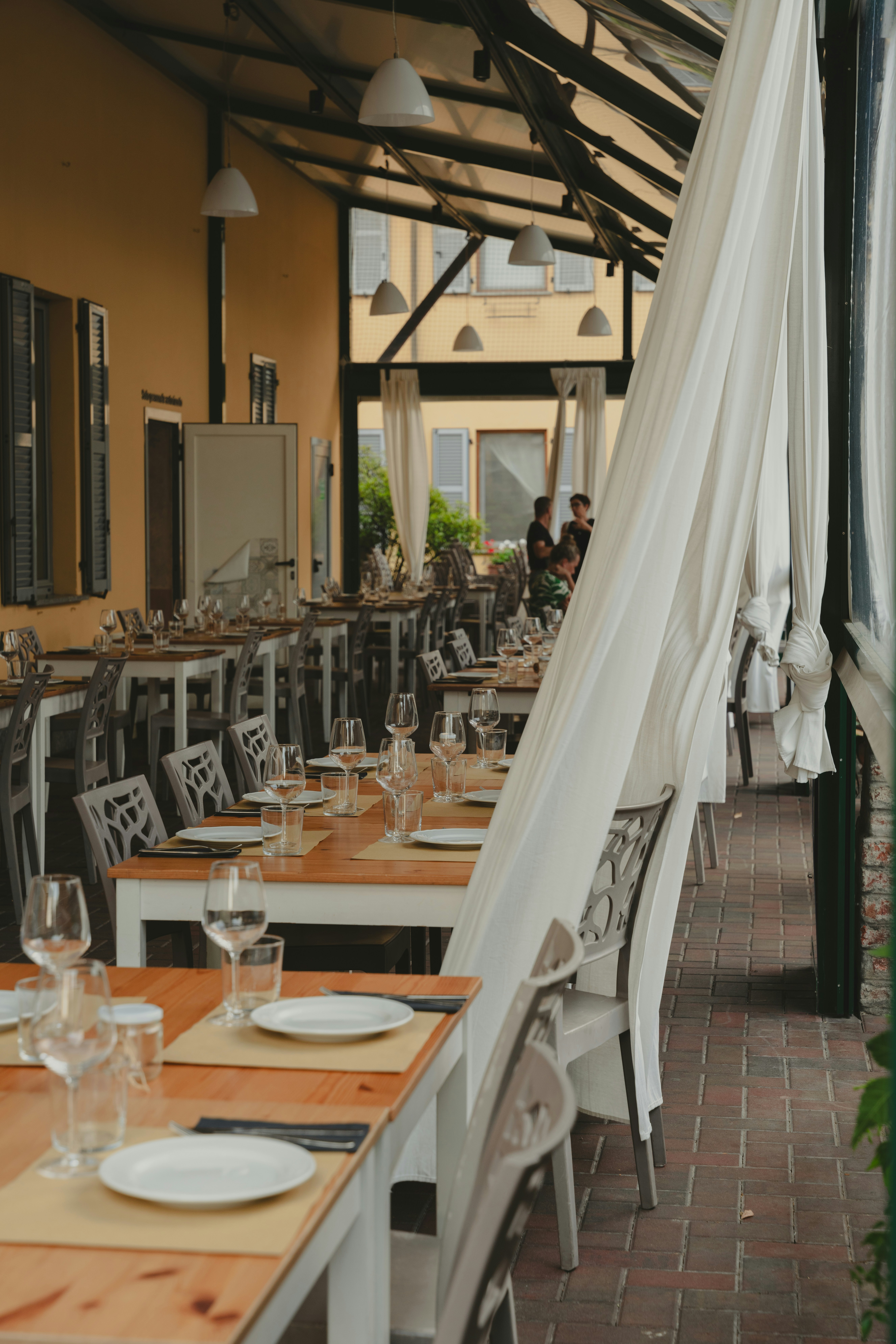 Elegant restaurant outdoor seating with protective covers