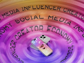 A cell phone sitting on top of a purple circle