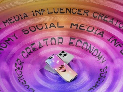 A cell phone sitting on top of a purple circle