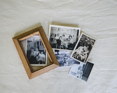 A group of photos sitting on top of a white sheet