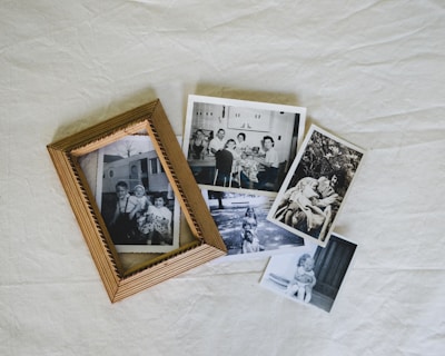 A group of photos sitting on top of a white sheet