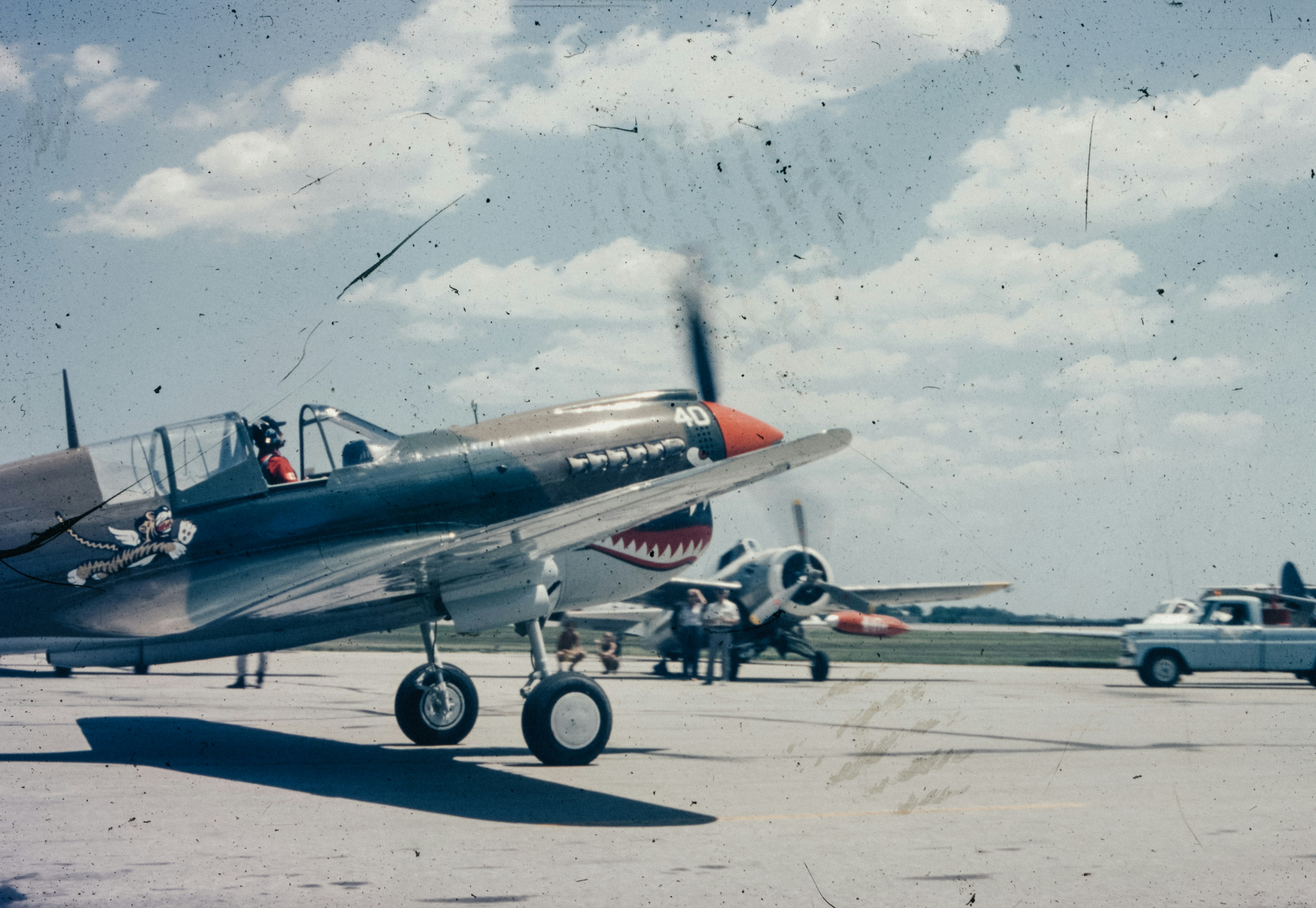 A small airplane sitting on top of an airport tarmac, 