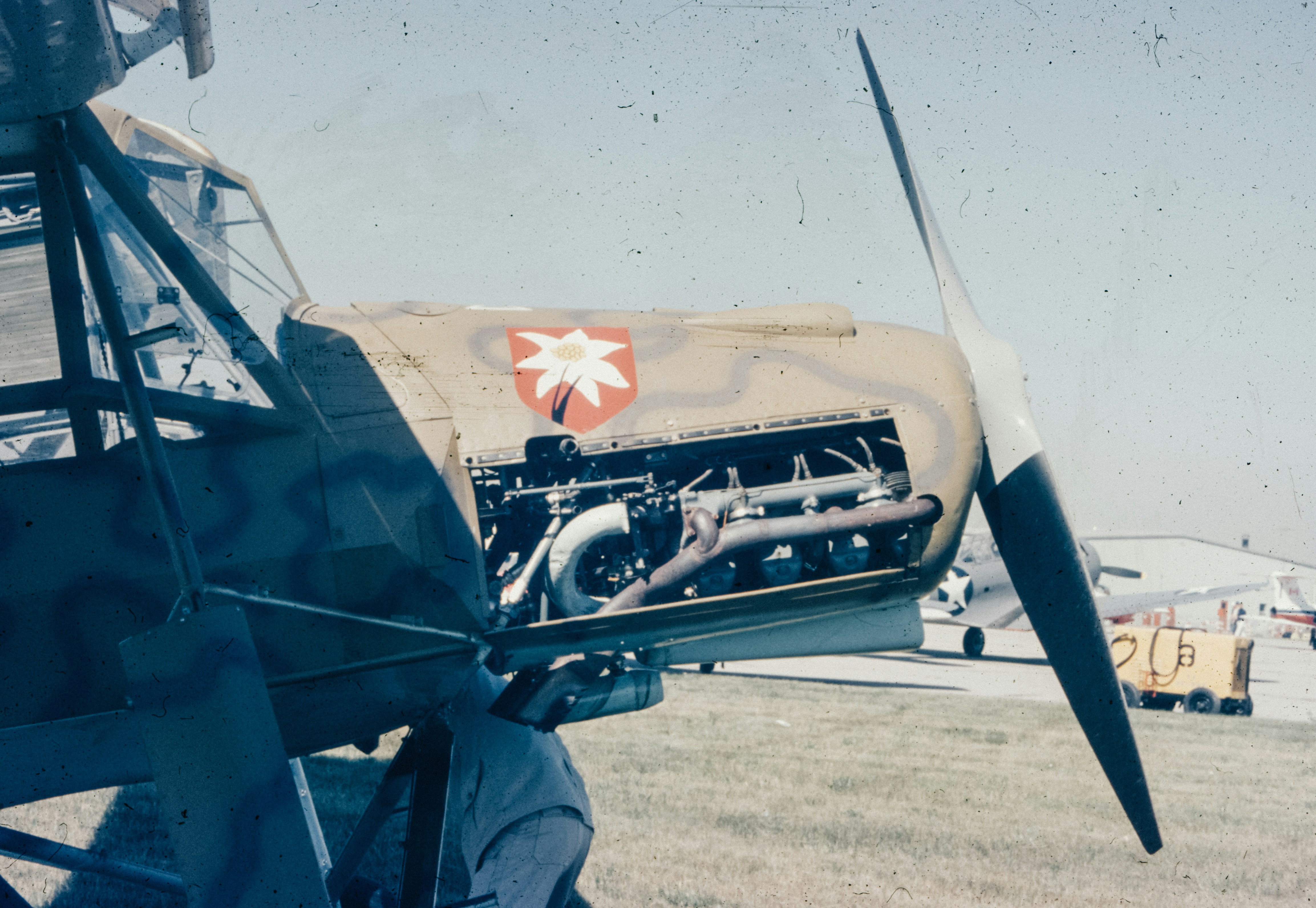 A man sitting in the cockpit of an airplane, 