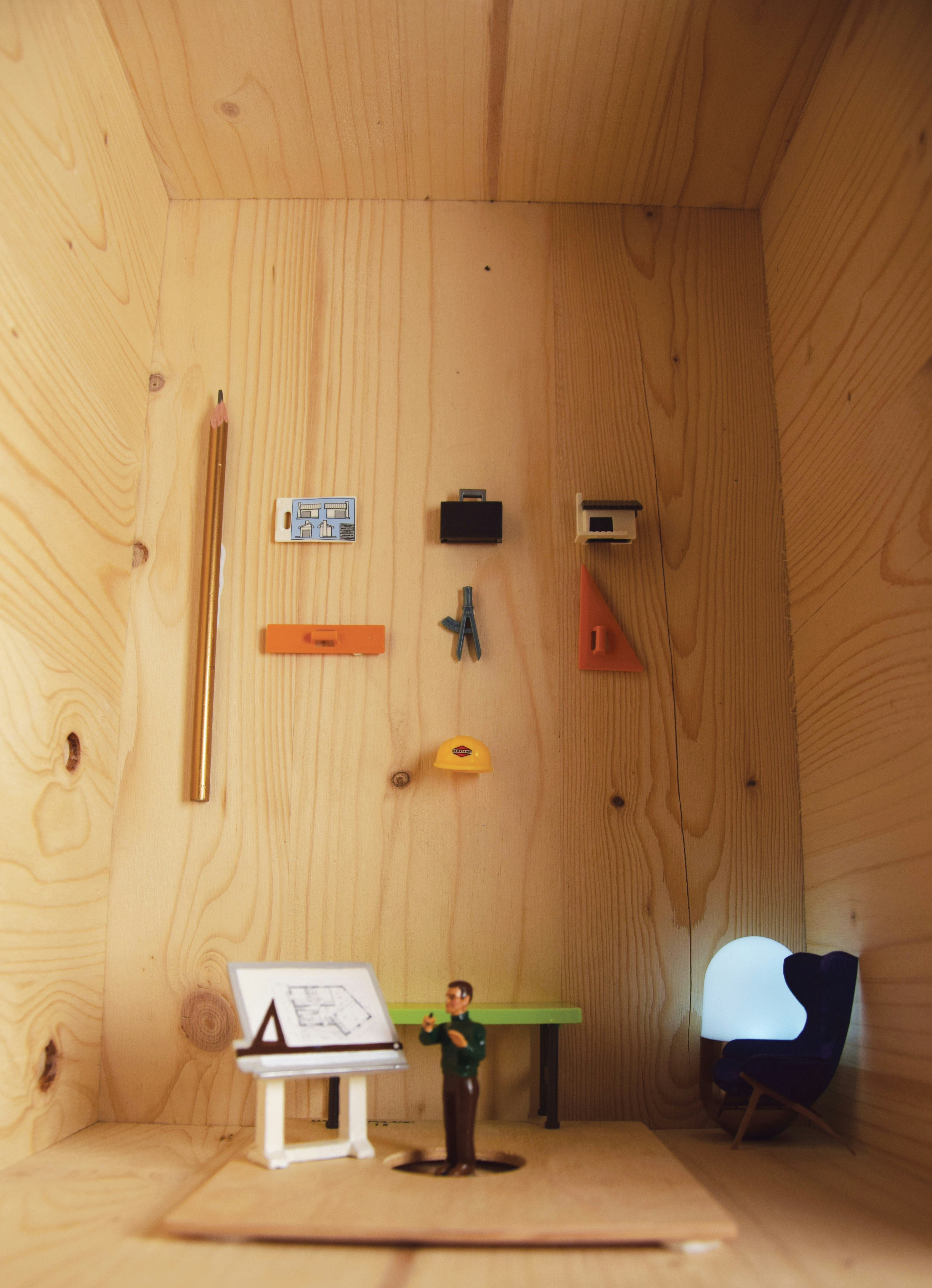 A small room with a desk and a chair