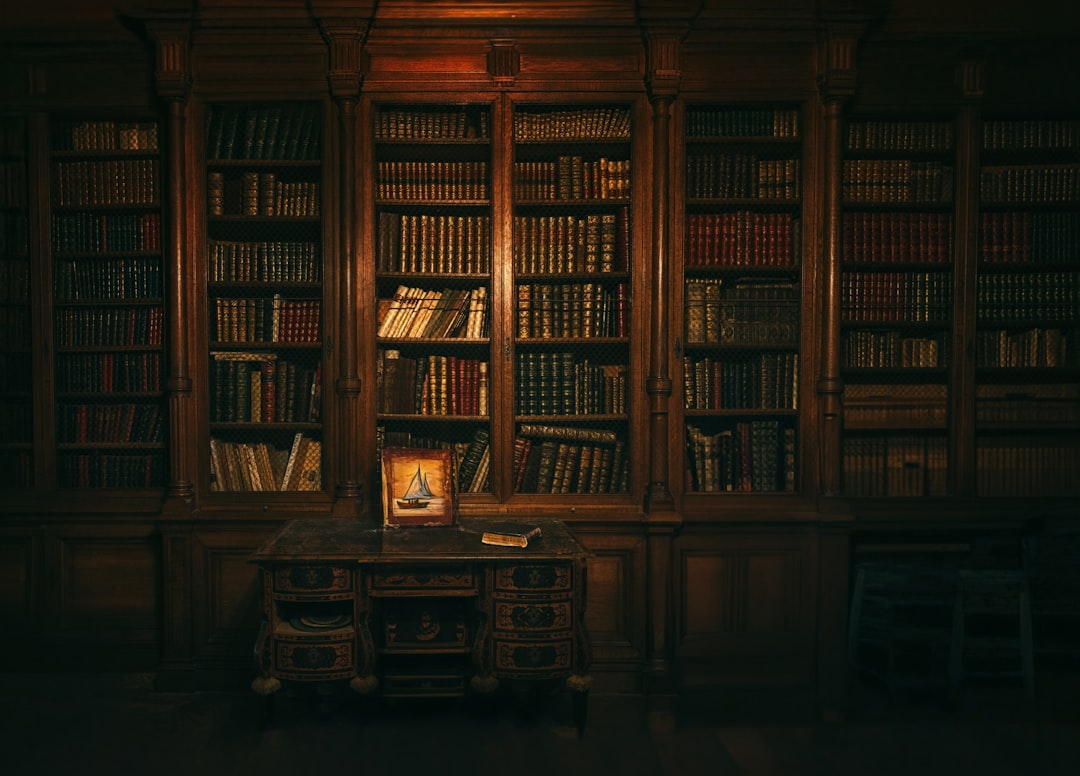 A room with a lot of books in it, Library...