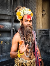 A man with a long beard and a red face