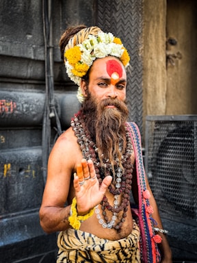 A man with a long beard and a red face