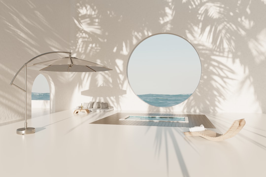 A white table with a mirror and umbrella on it,