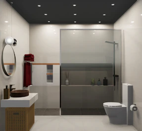 A bathroom with a toilet a sink and a mirror