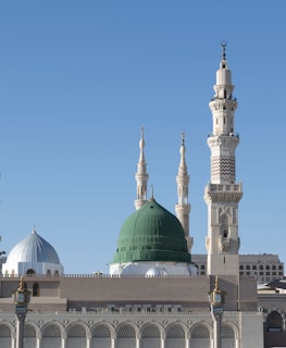 A large white building with a green dome