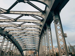 A view of a bridge from the ground