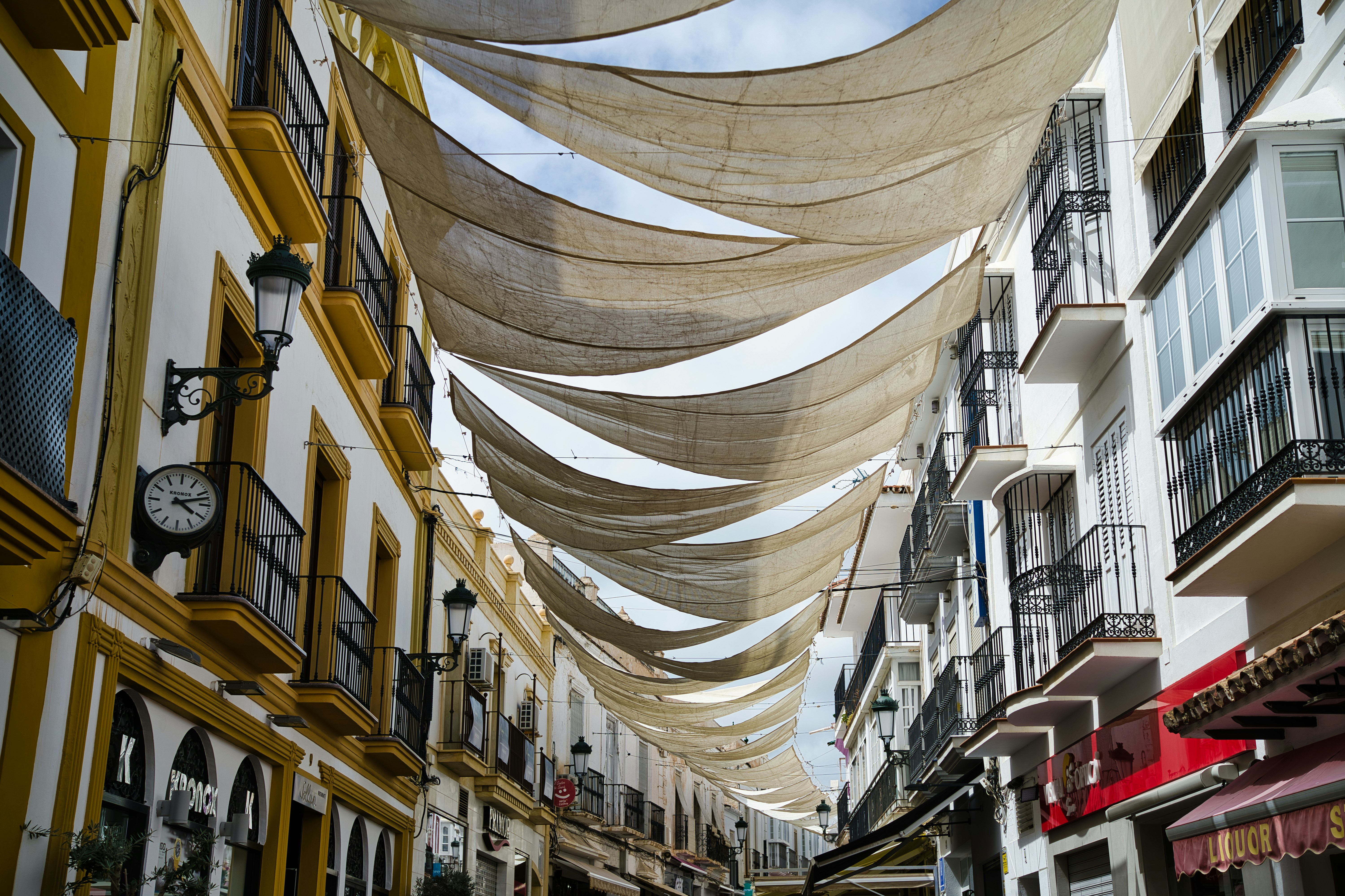 A city street lined with lots of tall buildings