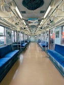 A train car with blue seats and windows