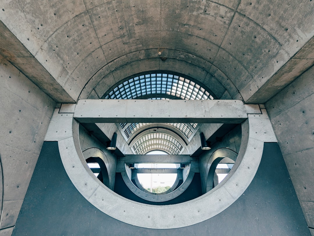 A view of the inside of a building through a circular window,