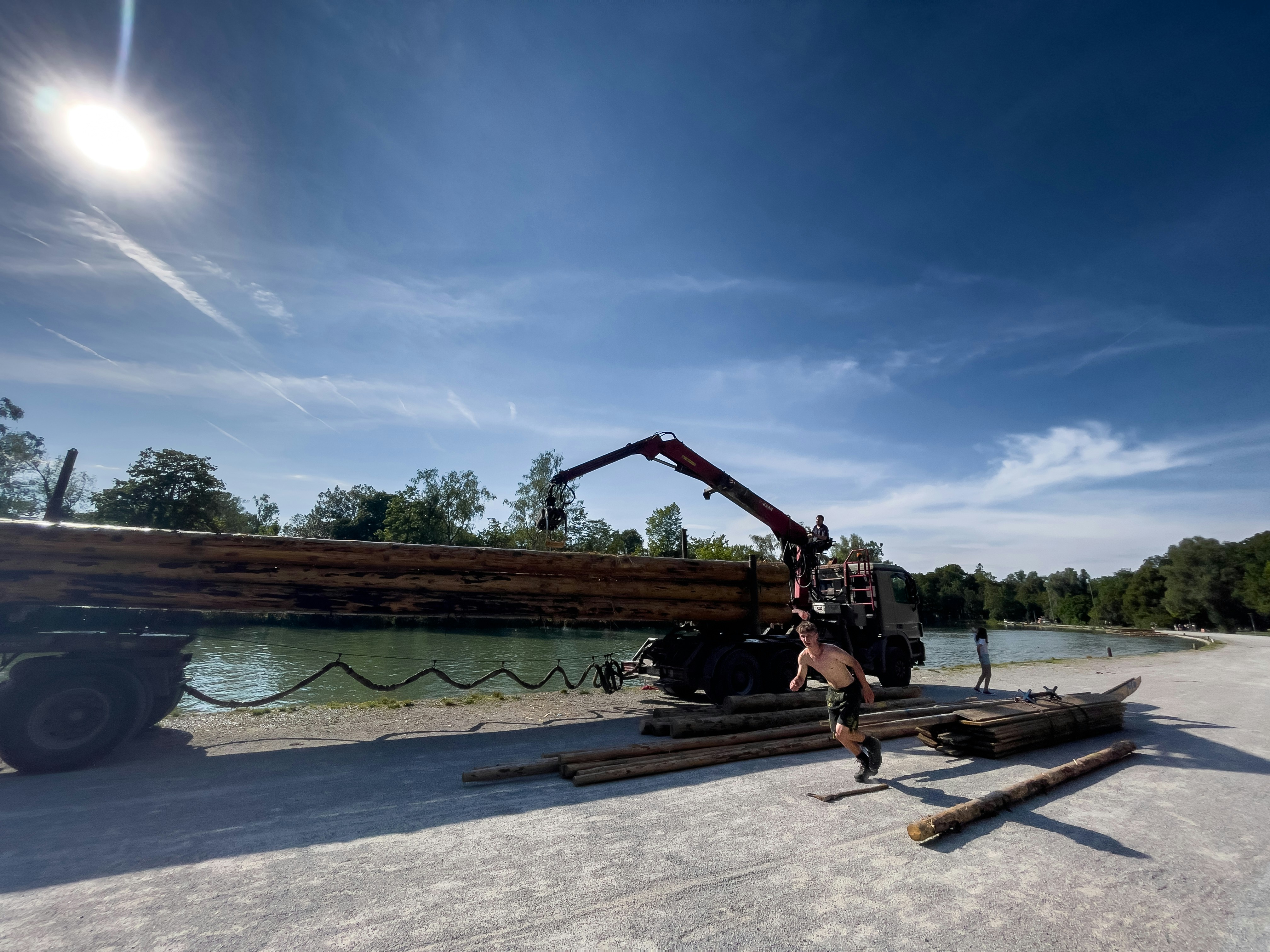 timber frame raising with a crane lifting a bent